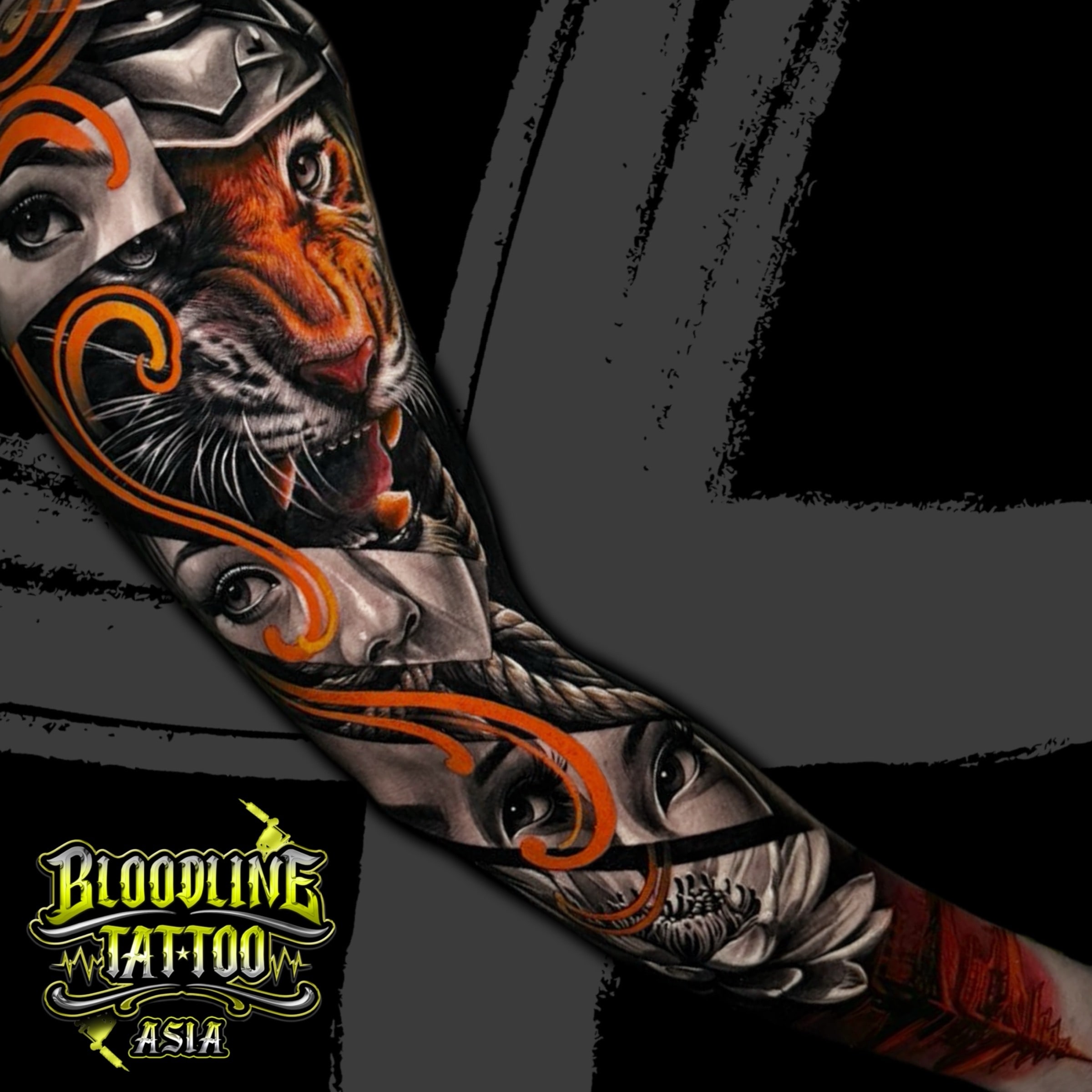 Colour full arm sleeve tattoo with a snarling tiger, realistic eyes, orange ribbon swirls, and a lotus flower at Bloodline Tattoo Bali.