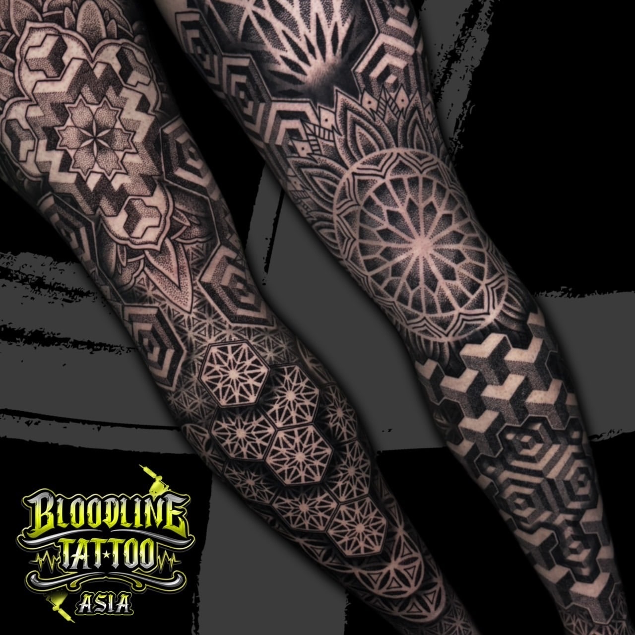 Full sleeve with layered mandalas, 3D cube optical patterns, and repeating hexagonal sacred geometry in black and grey dotwork, at Bloodline Tattoo Bali.